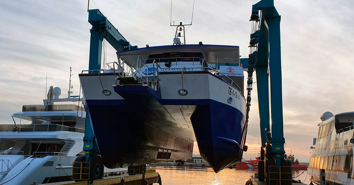 Sea Experience boat lifted by travelift crane in Ibiza